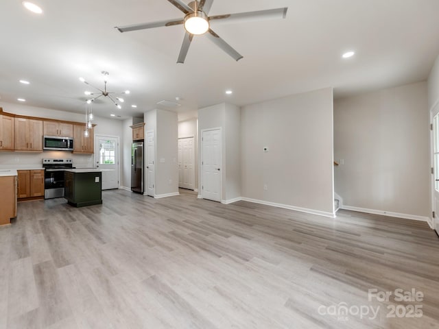 570 Key W Ave, Kannapolis, NC 28081 - kitchen featuring stainless steel appliances, open floor plan, recessed lighting, light countertops, and a center island