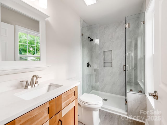 570 Key W Ave, Kannapolis, NC 28081 - full bath featuring a shower stall, vanity, toilet, and wood finished floors