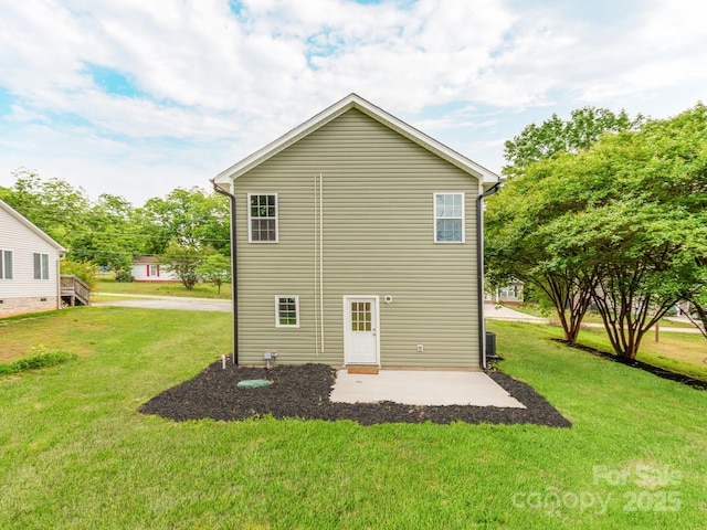 570 Key W Ave, Kannapolis, NC 28081 - back of property featuring a lawn and a patio area