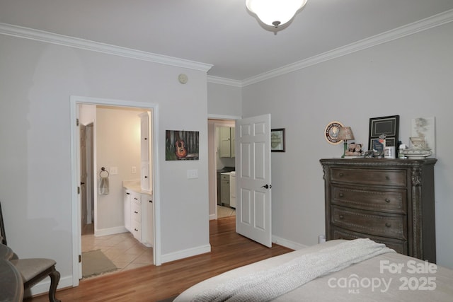 bedroom with light wood finished floors, connected bathroom, ornamental molding, and baseboards