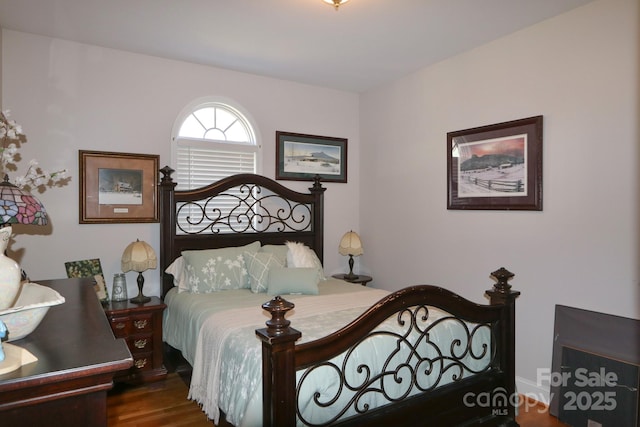 bedroom with wood finished floors