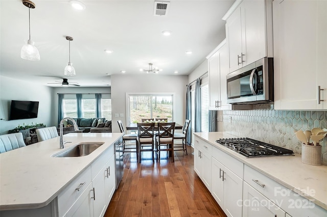 4337 Duplin Dr, Charlotte, NC 28214 - kitchen featuring a sink, open floor plan, stainless steel appliances, visible vents, and dark wood-style flooring