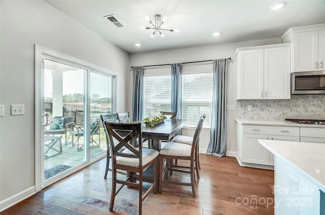 4337 Duplin Dr, Charlotte, NC 28214 - dining space with a wealth of natural light, visible vents, and wood finished floors