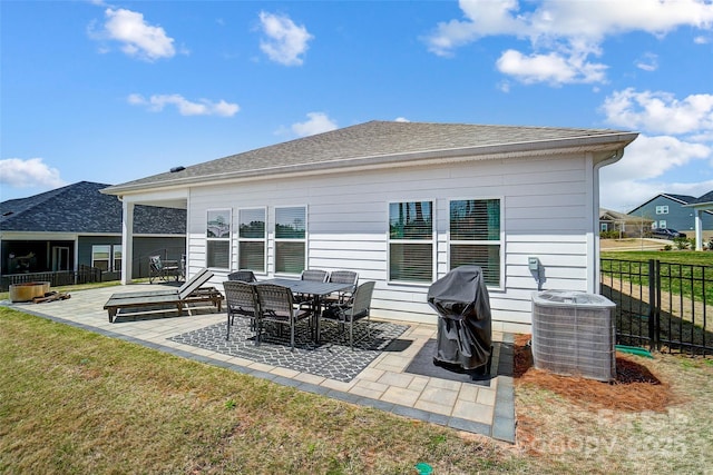 4337 Duplin Dr, Charlotte, NC 28214 - back of house with roof with shingles, fence, a patio, central AC, and a yard