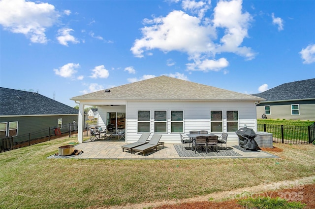 4337 Duplin Dr, Charlotte, NC 28214 - back of property with a patio, a fire pit, a fenced backyard, and a yard