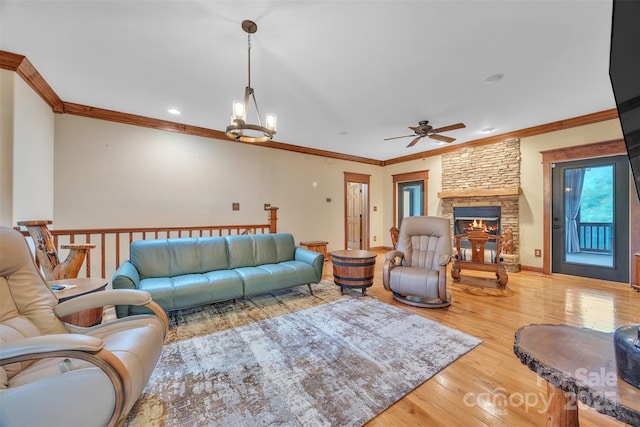 298 Poplar Grove Ct, Taylorsville, NC 28681 - living room with a fireplace, ceiling fan with notable chandelier, recessed lighting, wood finished floors, and ornamental molding