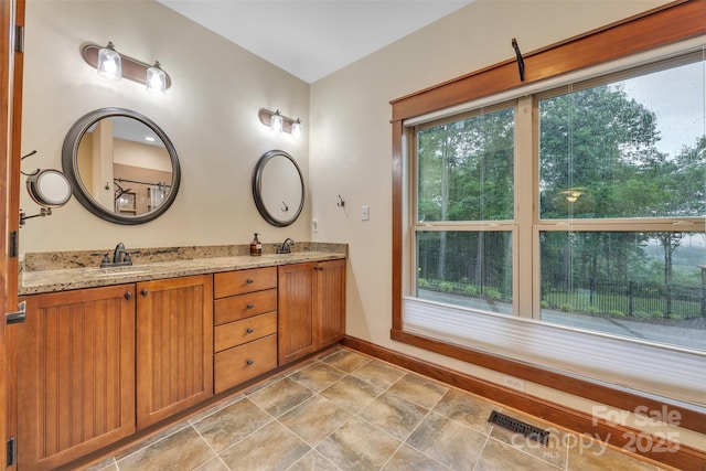 298 Poplar Grove Ct, Taylorsville, NC 28681 - bathroom featuring plenty of natural light, a sink, visible vents, and double vanity