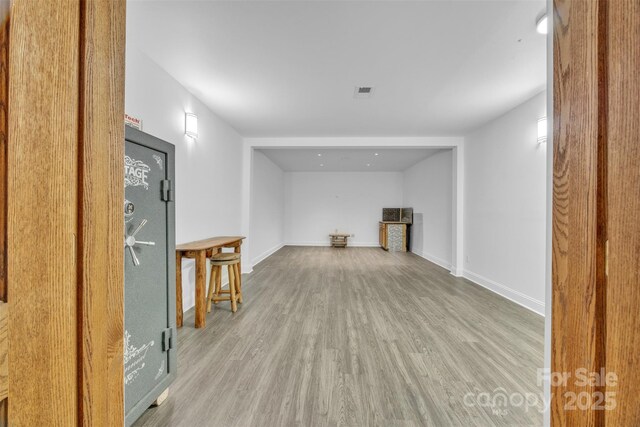 298 Poplar Grove Ct, Taylorsville, NC 28681 - below grade area with baseboards, visible vents, and wood finished floors