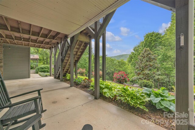 298 Poplar Grove Ct, Taylorsville, NC 28681 - view of patio featuring a mountain view and stairway