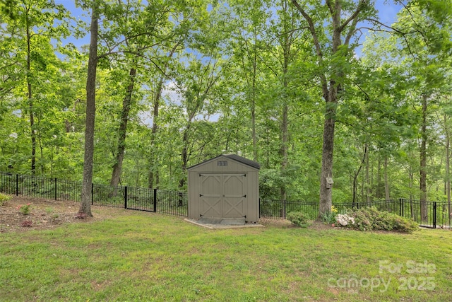 298 Poplar Grove Ct, Taylorsville, NC 28681 - view of yard featuring an outdoor structure, a fenced backyard, and a shed