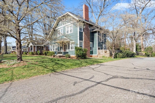 213 S Academy St, Mooresville, NC 28115 - view of front of house with a chimney and a front yard