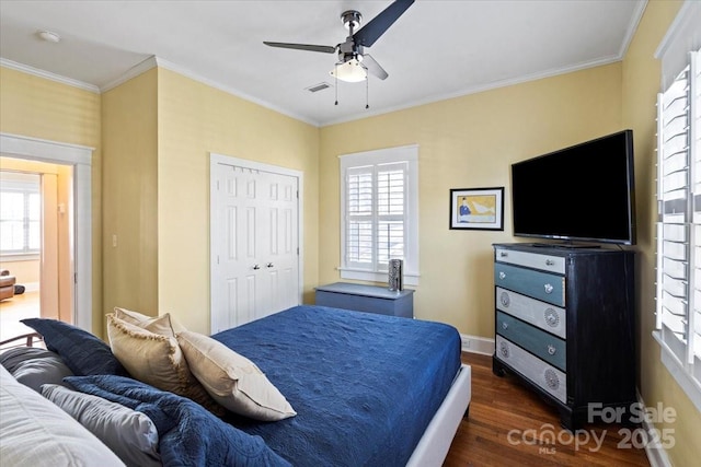 213 S Academy St, Mooresville, NC 28115 - bedroom featuring dark wood-style flooring, ornamental molding, baseboards, visible vents, and a closet