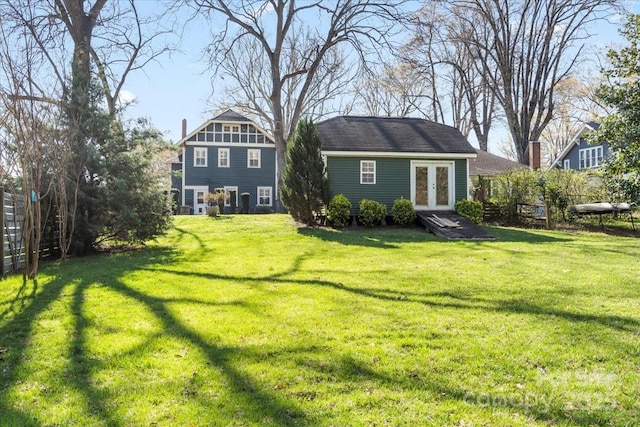 213 S Academy St, Mooresville, NC 28115 - back of house with an outdoor structure, fence, and a lawn