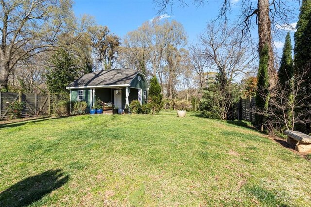 213 S Academy St, Mooresville, NC 28115 - view of yard with an outbuilding and fence