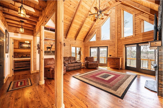 living room with wood-type flooring, beam ceiling, high vaulted ceiling, and wooden ceiling