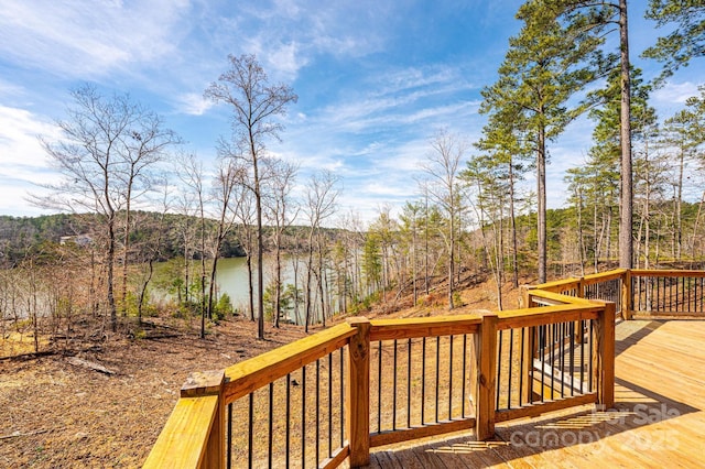 wooden deck featuring a water view