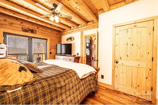 bedroom featuring light wood finished floors, french doors, baseboards, beamed ceiling, and wood ceiling