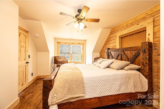 bedroom featuring ceiling fan, baseboards, and hardwood / wood-style floors