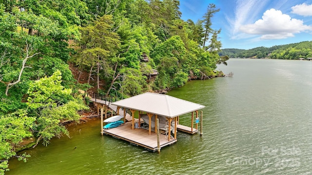 1519 Reflections Edge Dr, Granite Falls, NC 28630 - dock area featuring boat lift, a water view, and a forest view