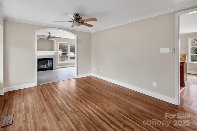 403 Hillcrest Dr, Huntersville, NC 28078 - unfurnished living room with wood finished floors, visible vents, ornamental molding, and ceiling fan