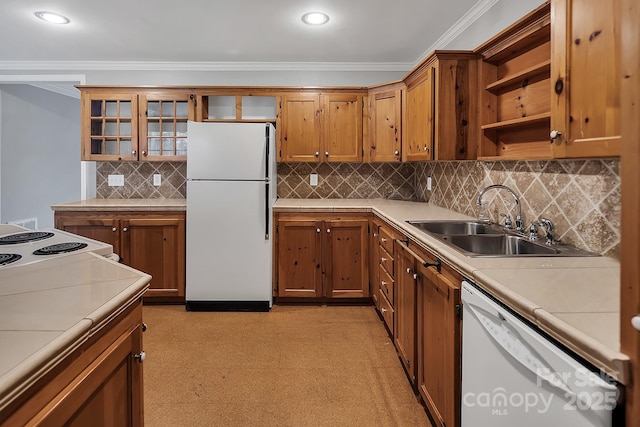 403 Hillcrest Dr, Huntersville, NC 28078 - kitchen with crown molding, a sink, light floors, brown cabinets, and white appliances