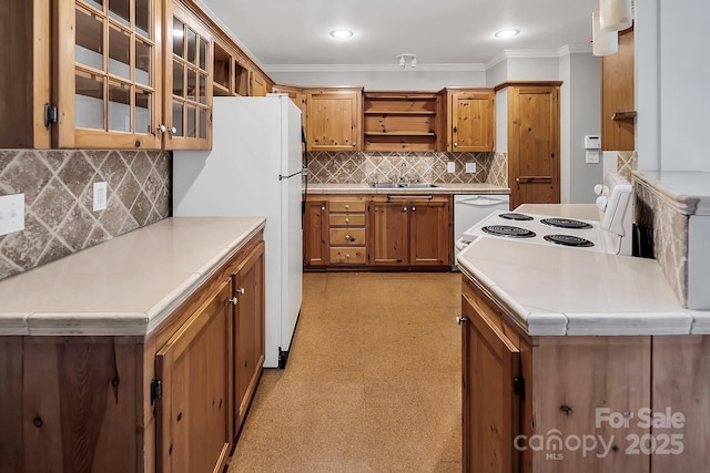 403 Hillcrest Dr, Huntersville, NC 28078 - kitchen with crown molding, open shelves, white appliances, brown cabinets, and light floors