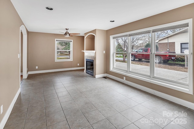 403 Hillcrest Dr, Huntersville, NC 28078 - unfurnished living room featuring baseboards, ceiling fan, a tile fireplace, and tile patterned floors