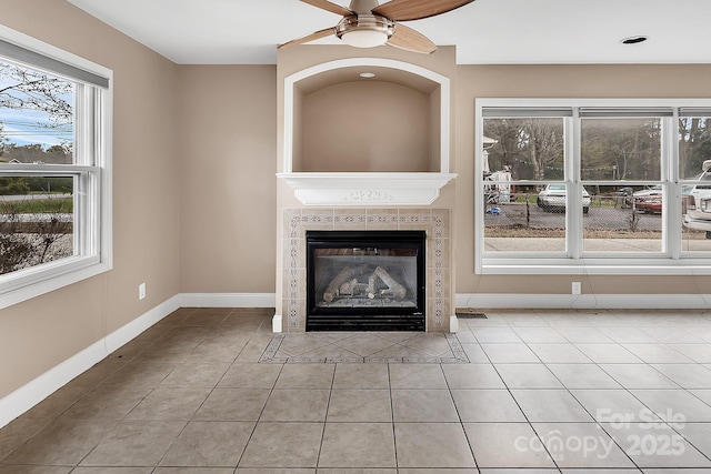 403 Hillcrest Dr, Huntersville, NC 28078 - unfurnished living room with baseboards, a fireplace, ceiling fan, and tile patterned flooring