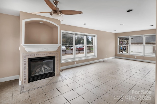 403 Hillcrest Dr, Huntersville, NC 28078 - unfurnished living room featuring light tile patterned flooring, baseboards, a tiled fireplace, and ceiling fan