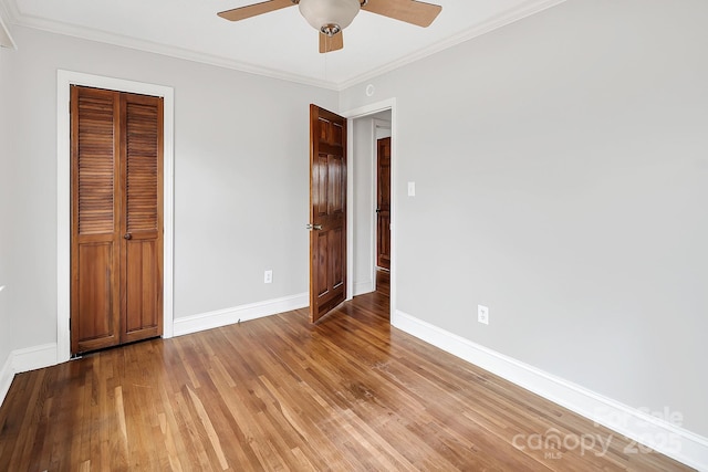 403 Hillcrest Dr, Huntersville, NC 28078 - unfurnished bedroom with light wood-style flooring, a closet, ornamental molding, and baseboards