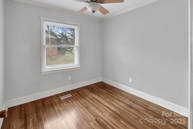 403 Hillcrest Dr, Huntersville, NC 28078 - unfurnished room with crown molding, wood finished floors, baseboards, visible vents, and ceiling fan