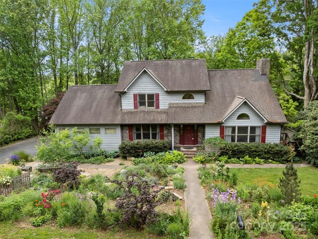 5 Spring Cove Ct, Arden, NC 28704 - traditional-style house with a chimney, fence, a shingled roof, and asphalt driveway