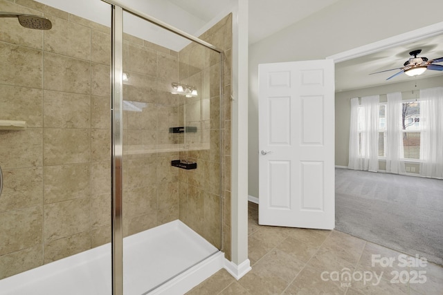 bathroom featuring a stall shower, tile patterned floors, and a ceiling fan