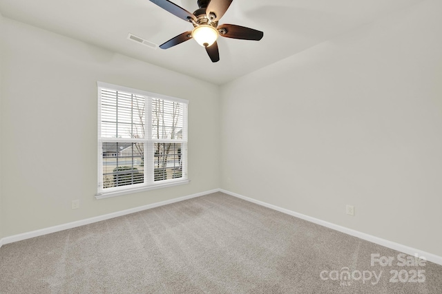 unfurnished room with baseboards, visible vents, and carpet floors
