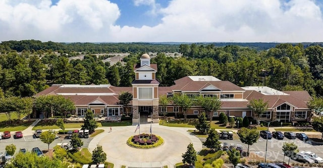 aerial view featuring a wooded view