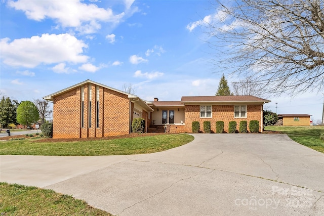 3829 Norman Rd, Morganton, NC 28655 - single story home featuring a chimney, brick siding, driveway, and a front lawn