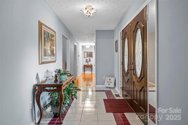 3829 Norman Rd, Morganton, NC 28655 - tiled foyer entrance featuring baseboards and a textured ceiling