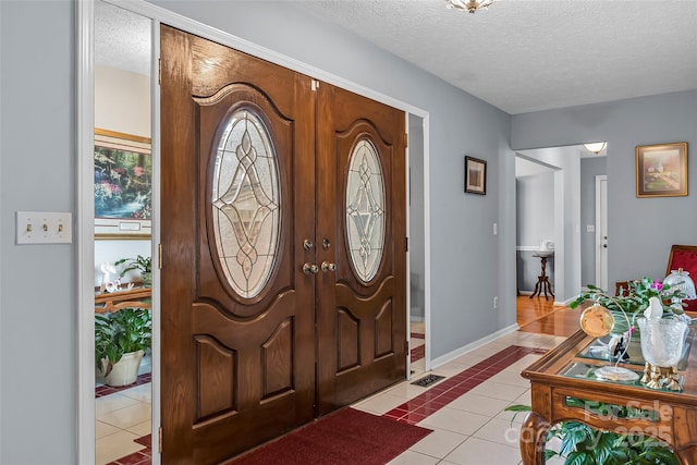 3829 Norman Rd, Morganton, NC 28655 - foyer entrance featuring light tile patterned floors, visible vents, baseboards, and a textured ceiling