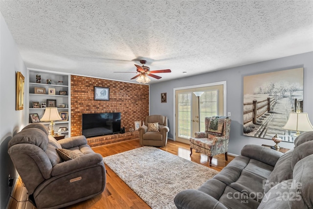 3829 Norman Rd, Morganton, NC 28655 - living area featuring wood finished floors, ceiling fan, and a textured ceiling