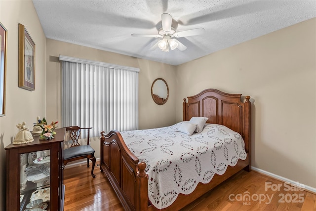 3829 Norman Rd, Morganton, NC 28655 - bedroom with baseboards, light wood-type flooring, and a textured ceiling