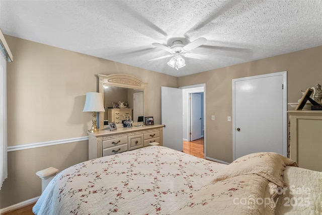 3829 Norman Rd, Morganton, NC 28655 - bedroom featuring baseboards, a textured ceiling, and ceiling fan