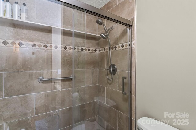 3829 Norman Rd, Morganton, NC 28655 - bathroom featuring toilet and a stall shower