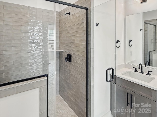 full bathroom with a stall shower and vanity
