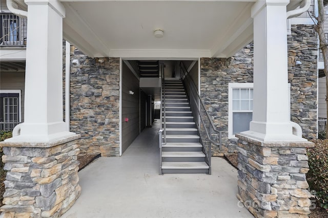 entrance to property featuring stone siding
