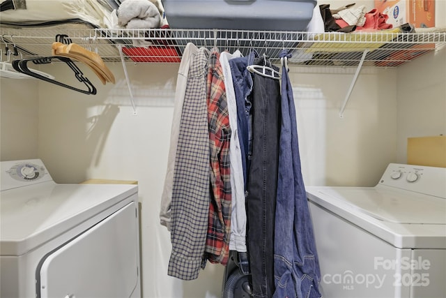 laundry area featuring washing machine and clothes dryer and laundry area