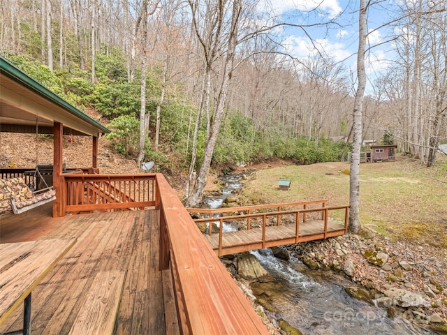 3975 Mountain Creek Rd, Robbinsville, NC 28771 - wooden deck featuring a lawn and a forest view