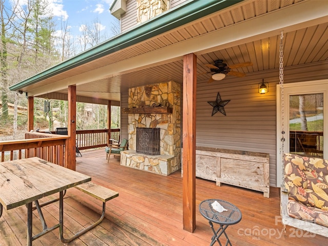 3975 Mountain Creek Rd, Robbinsville, NC 28771 - deck with an outdoor stone fireplace