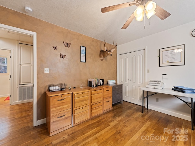 3975 Mountain Creek Rd, Robbinsville, NC 28771 - office area with baseboards, visible vents, ceiling fan, and wood finished floors