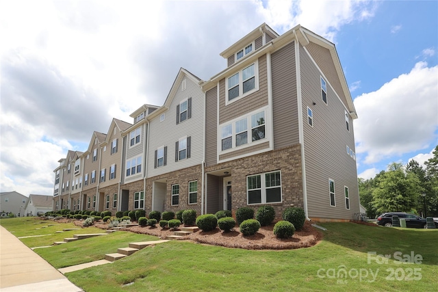 8232 Waxhaw Hwy, Waxhaw, NC 29173 - view of front facade featuring a front lawn and brick siding