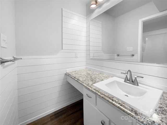 4936 Sardis Rd Unit B, Charlotte, NC 28270 - bathroom with vanity, wood finished floors, and wooden walls